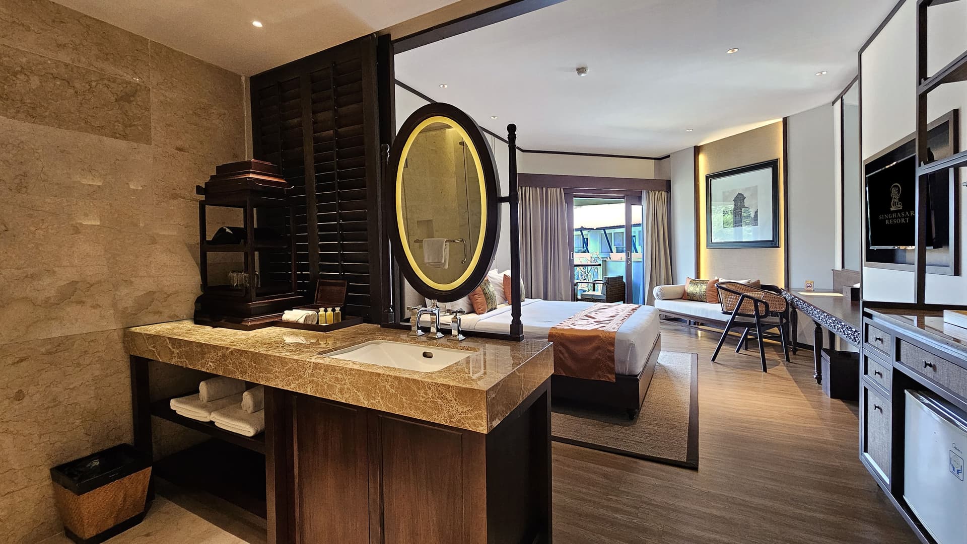 Deluxe Room - Marble vanity bathroom with backlit mirror